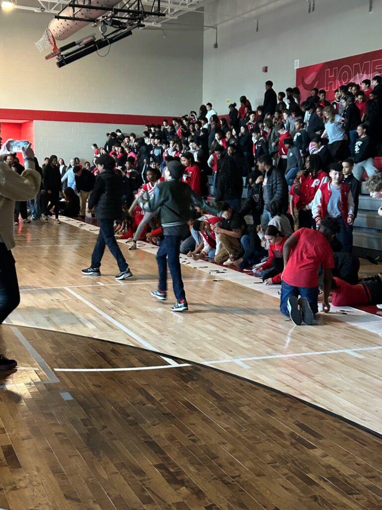 High school students participating in an exploitation prevention school assembly presentation.